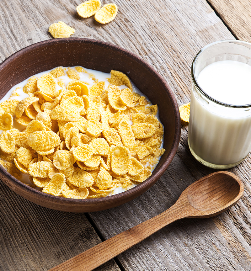 Image of cereal in a bowl with a glass of milk