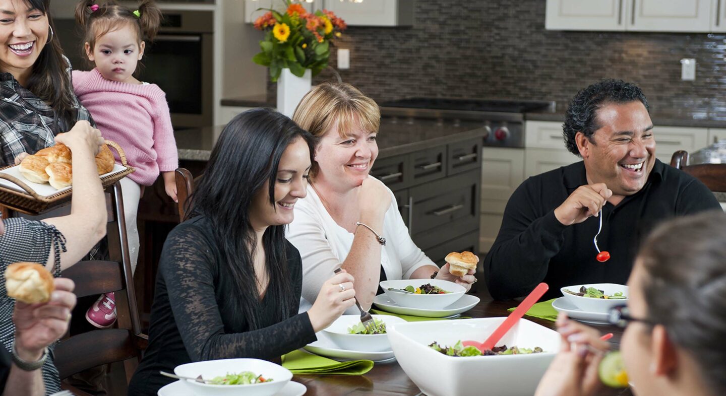 Image of a family eating salad
