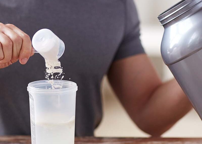 Image of a man making a protein shake