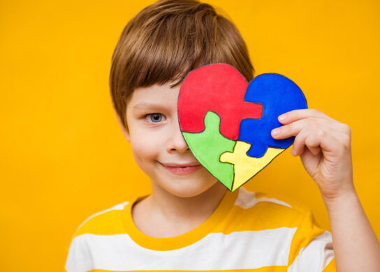 Boy with autism puzzle heart