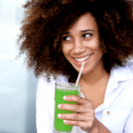 Woman drinking green smoothie