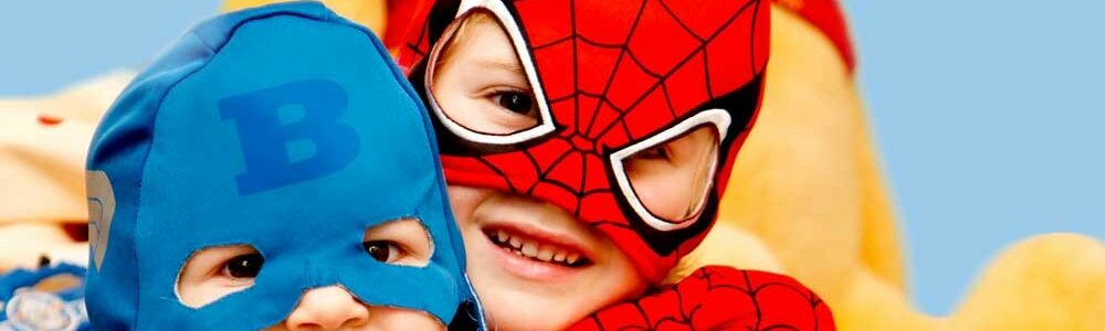 Kids in superhero costumes