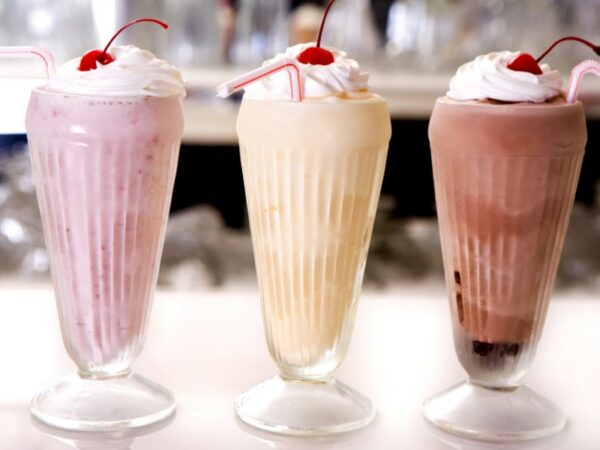 Three shakes and smoothies in glasses