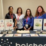 Image of four women at a Balchem booth