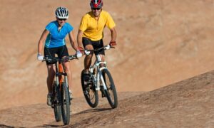 Image of a man and woman on mountain bikes