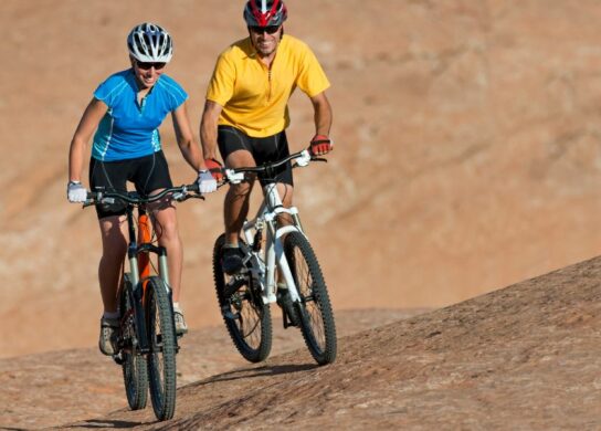 Image of a man and woman on mountain bikes
