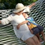 Woman and child sitting on a hammock