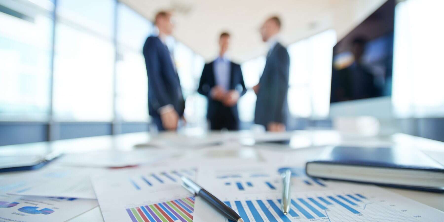 Financial reports Financial documents and charts on a table.