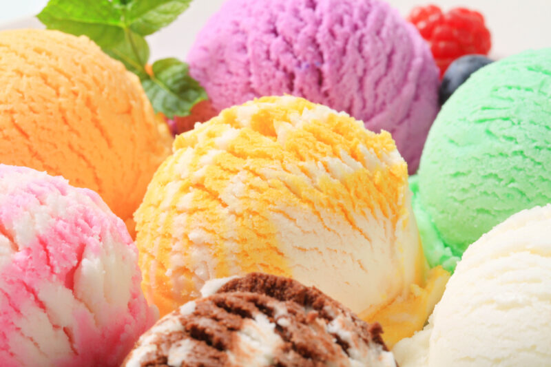 Colorful frozen scooped treats different colorful flavors