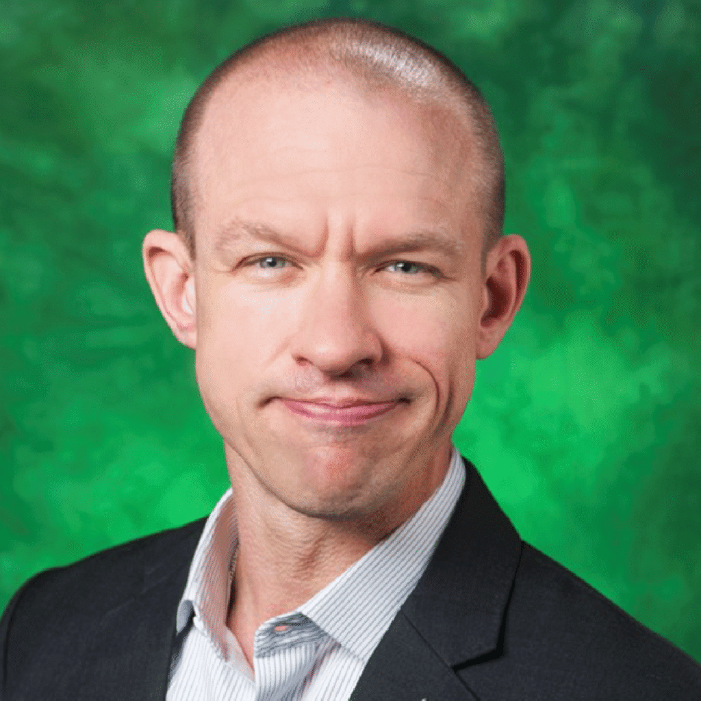 HNH Web Dr McFarlin Headshot 1250×1250 Portrait of Dr. Brian K. McFarlin in a professional suit with a green background.
