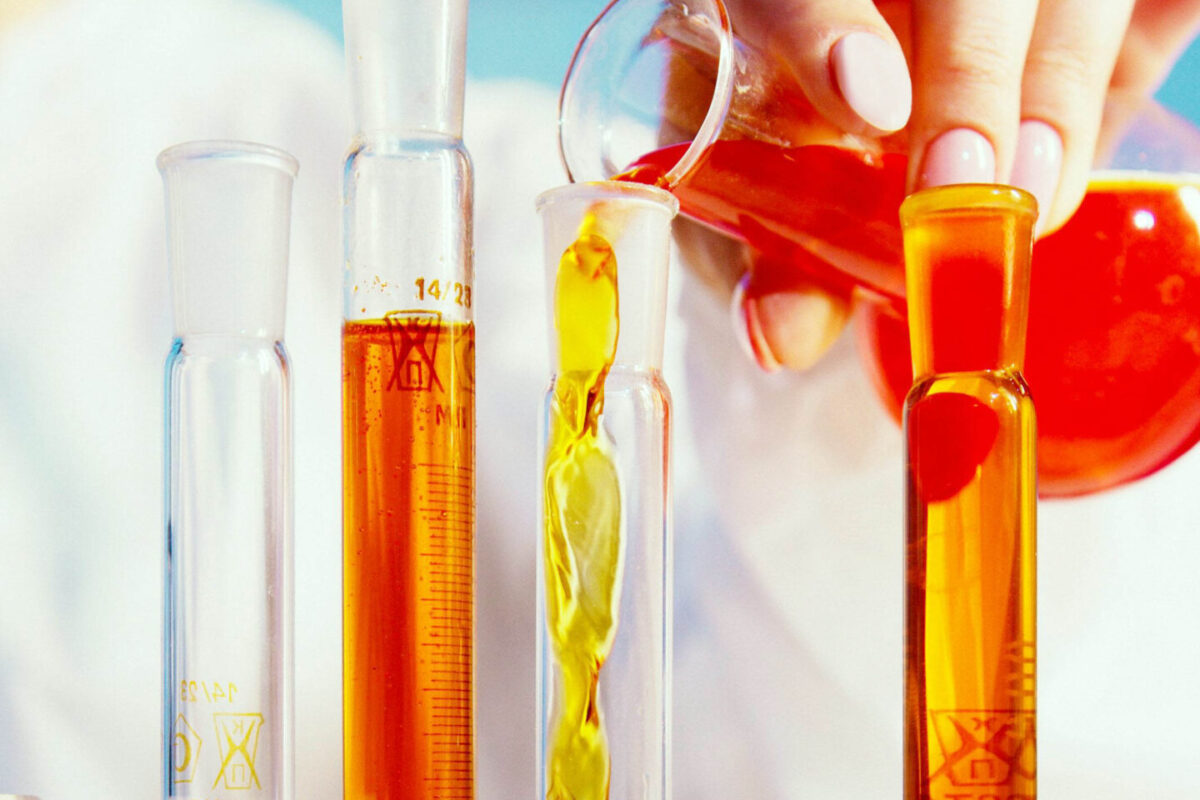 Scientist Filling Test Tubes