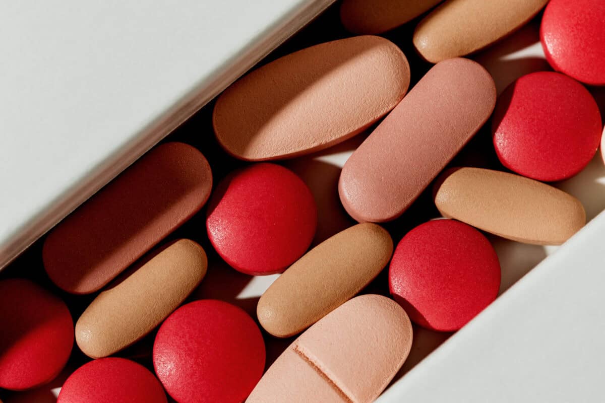 Pills on white Pills and vitamins in a drawer.