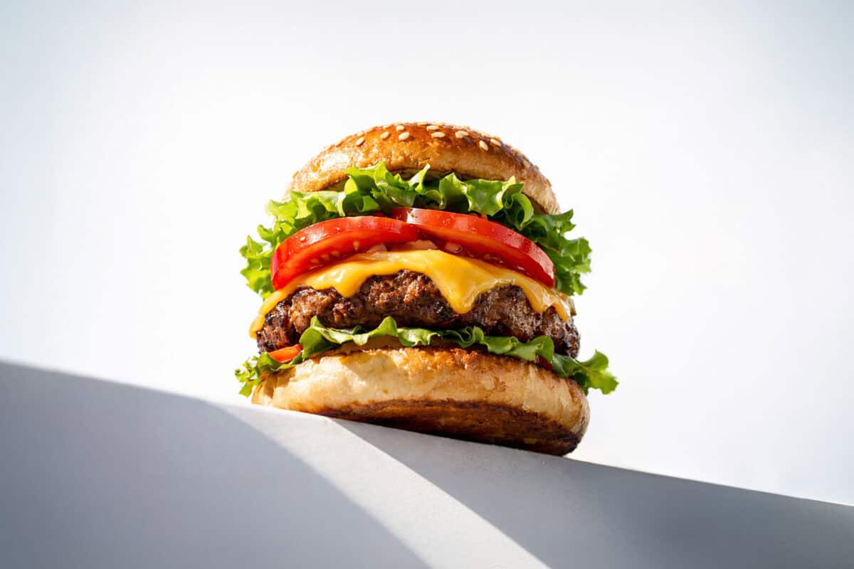 image of a hamburger on a ledge with balchem meatshure salts