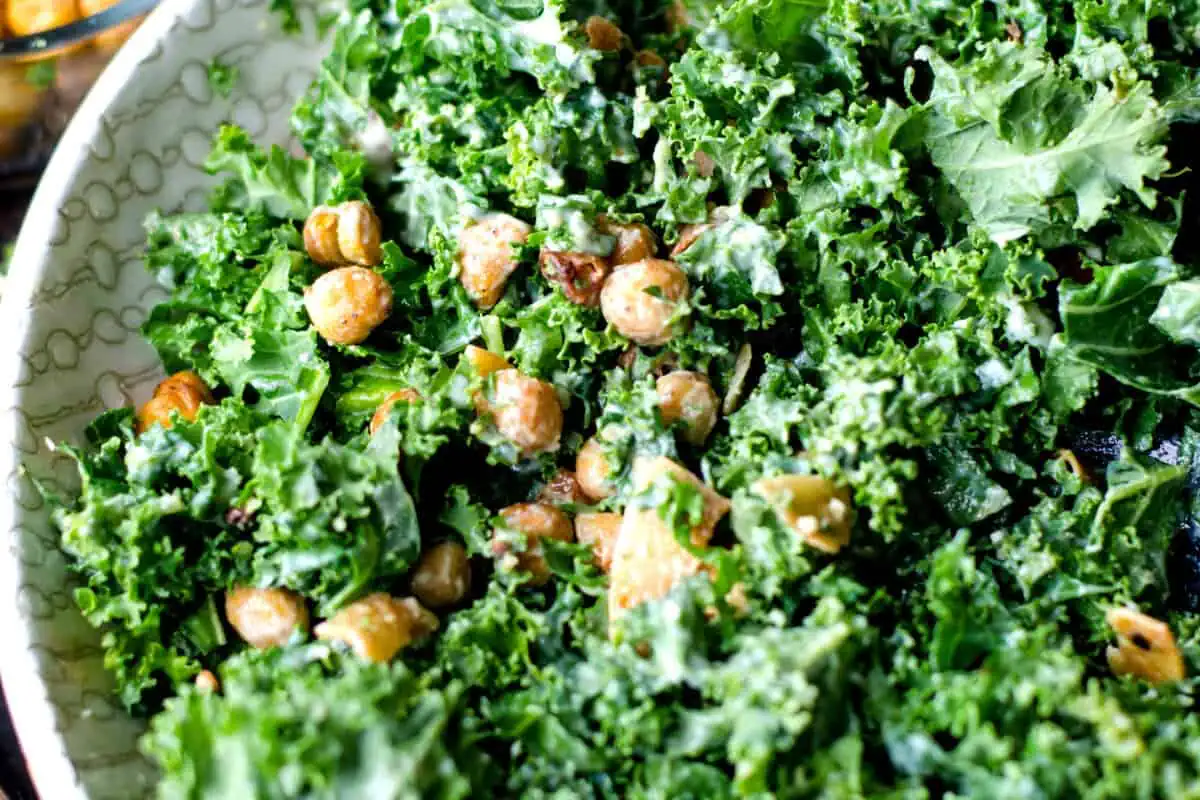 Kale salad with chickpeas and garlic dressing.