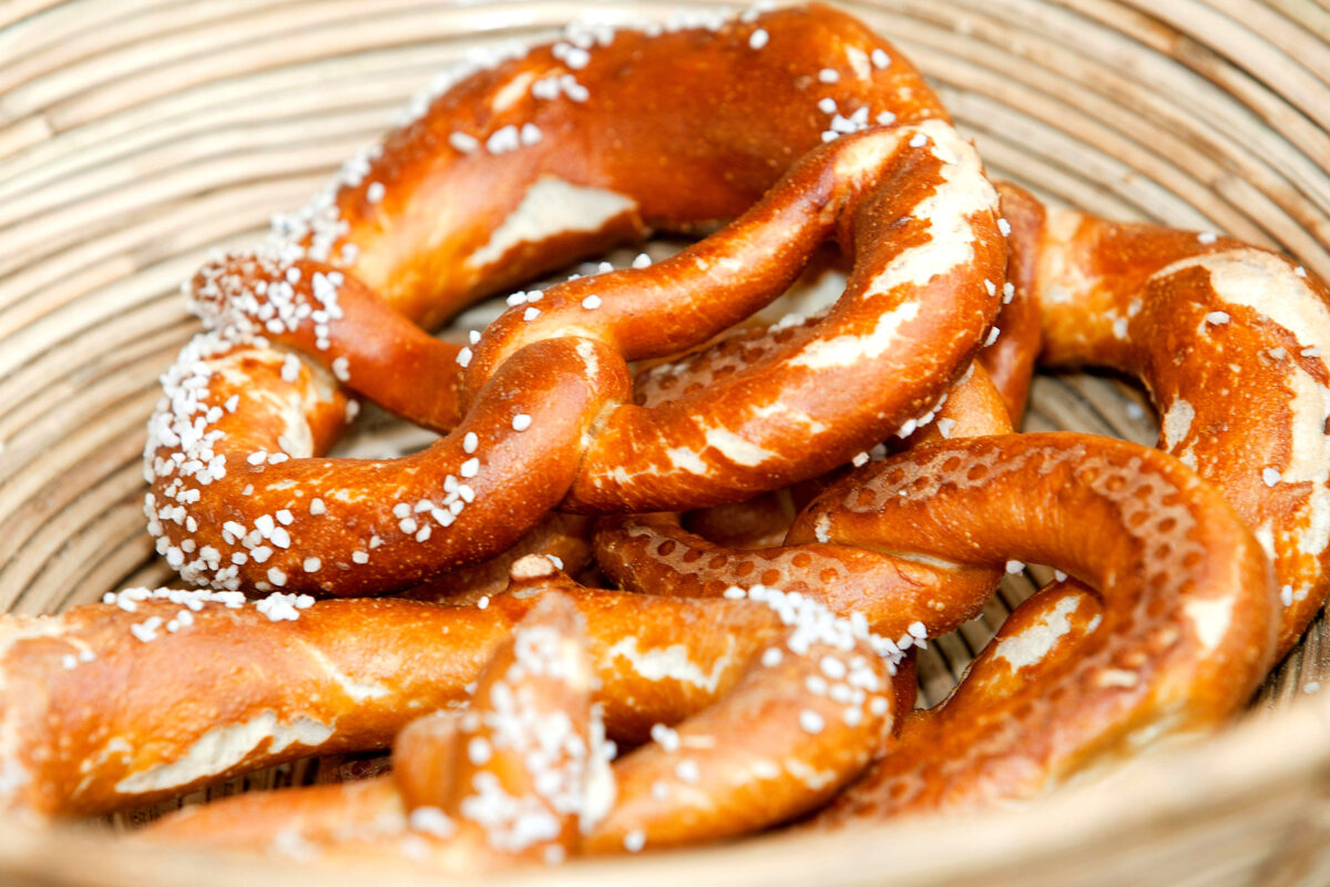 Basket with salted, golden-brown pretzels.