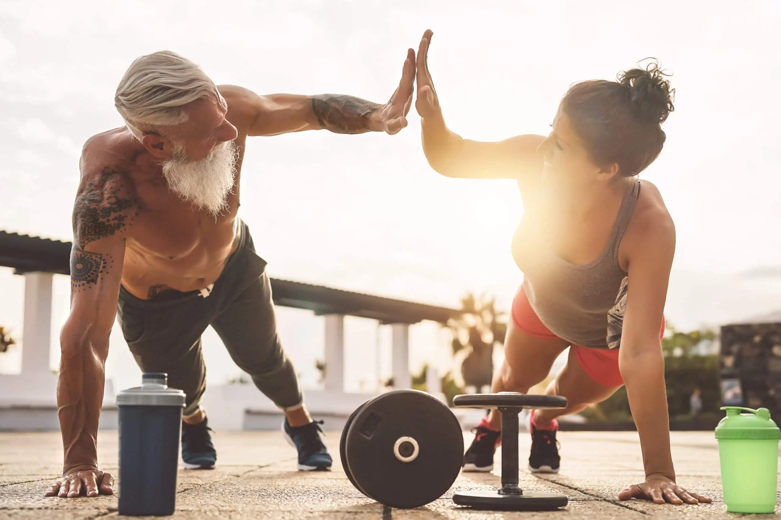 Fitness couple high-fiving