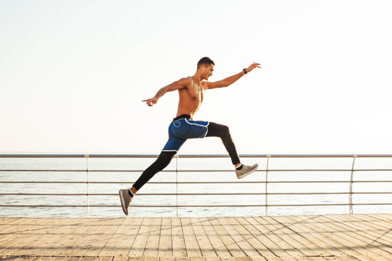 Man on a pier jumping