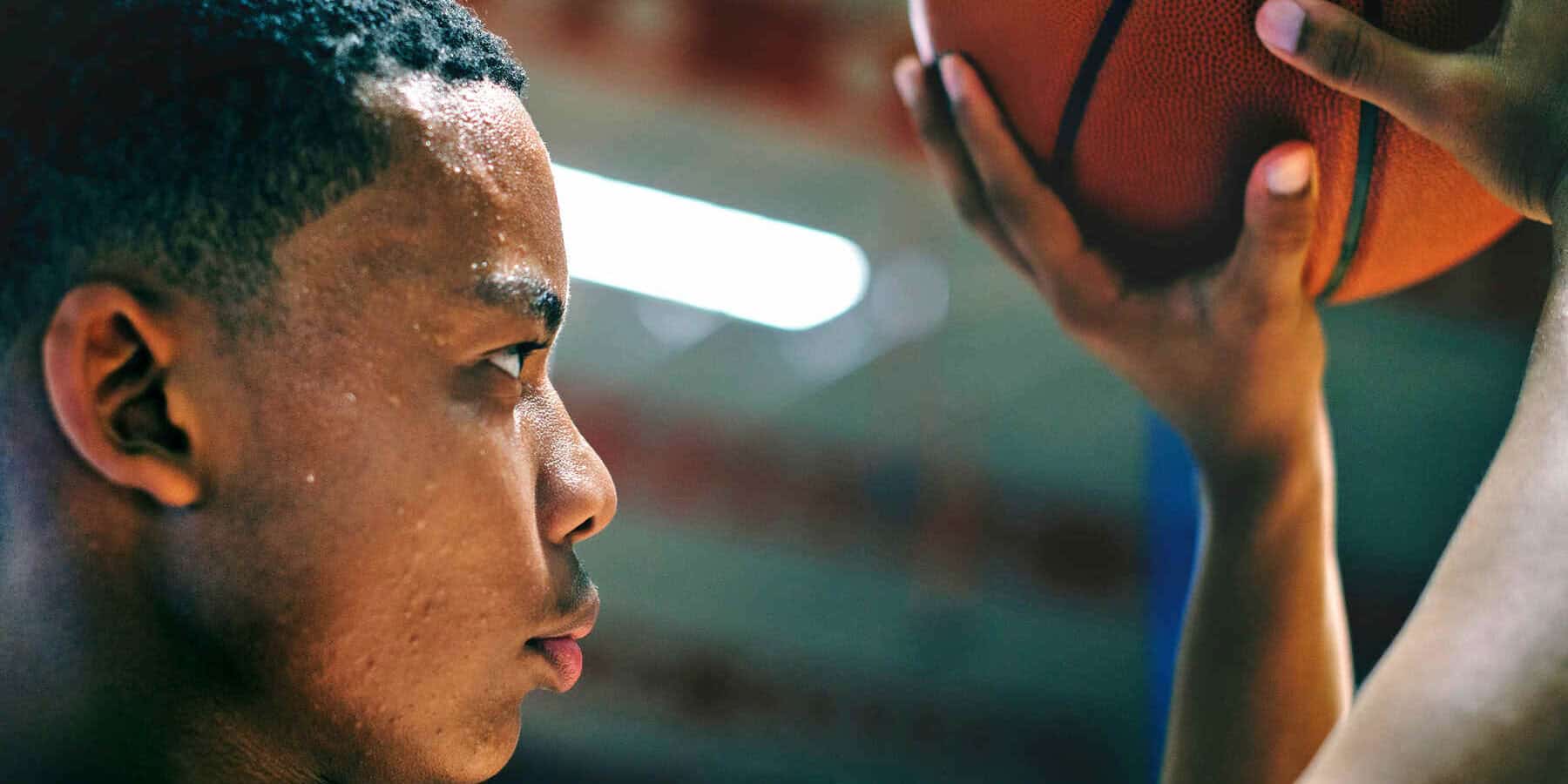 Image of a man shooting a basketball