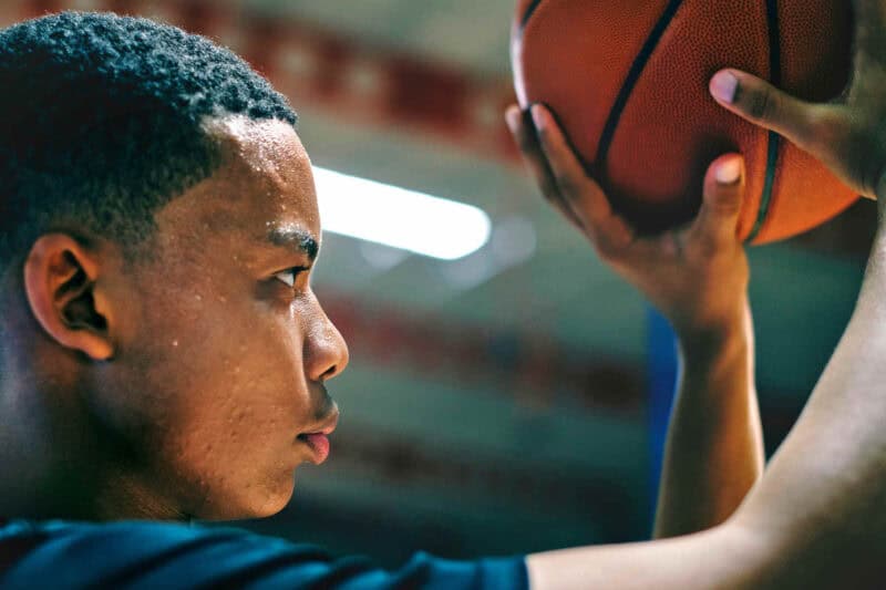 Image of a man shooting a basketball
