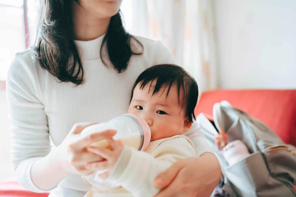 Prenatal mom feeding baby