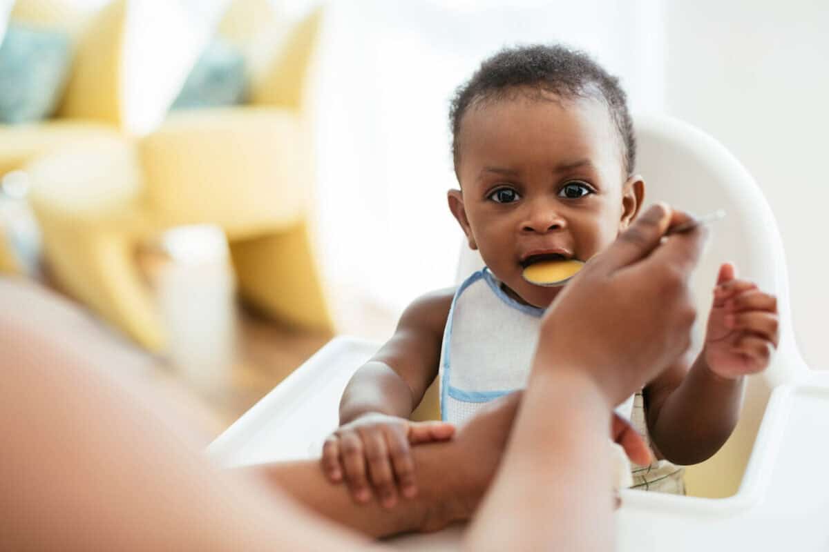 baby being fed iron prenatal health