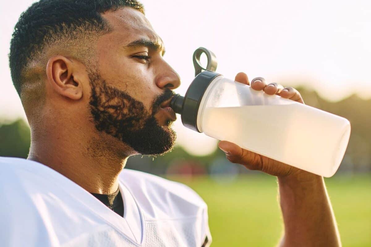 Image Football Player 1300×1000 image of a football player drinking a supplement shake of choline