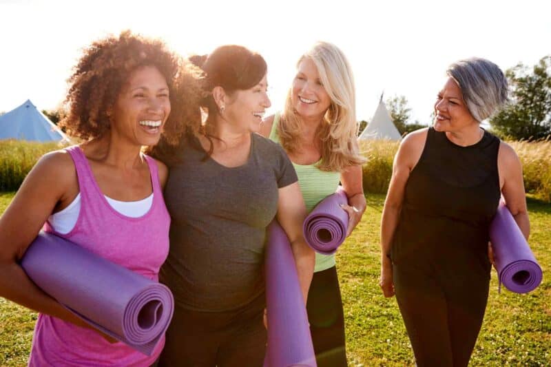 mid-aged women going to a yoga class