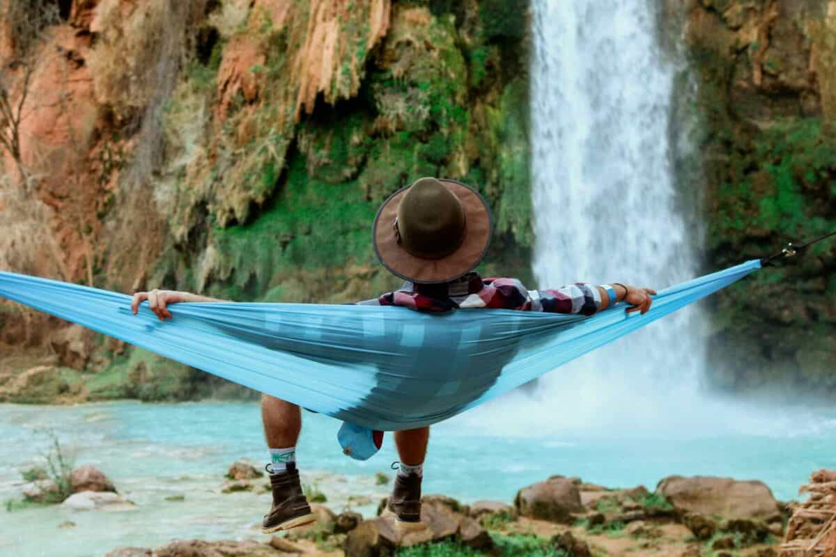man-relaxing_1800x1200 image of a man relaxing on a blue hammock