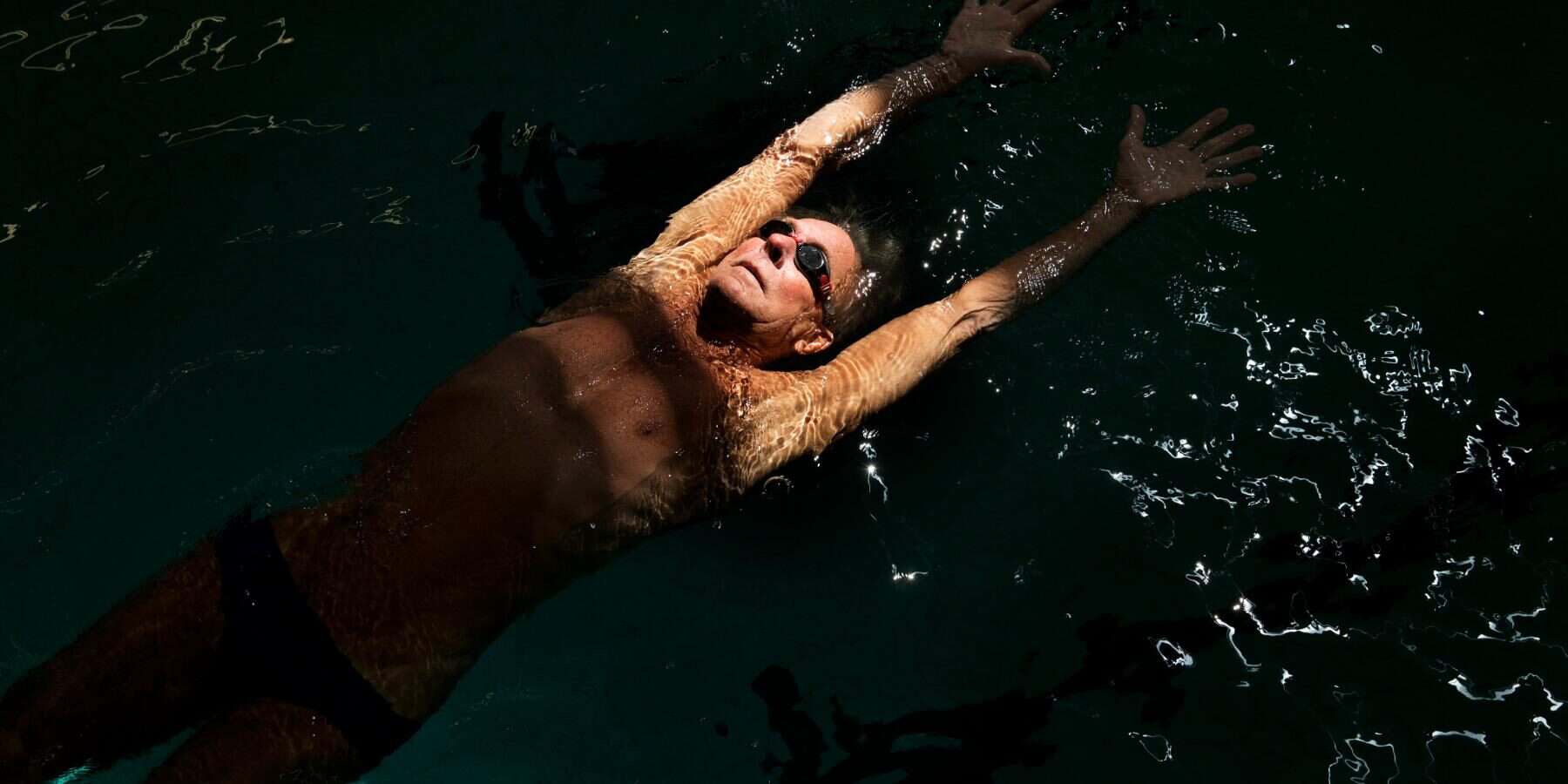 Image of an older man swimming