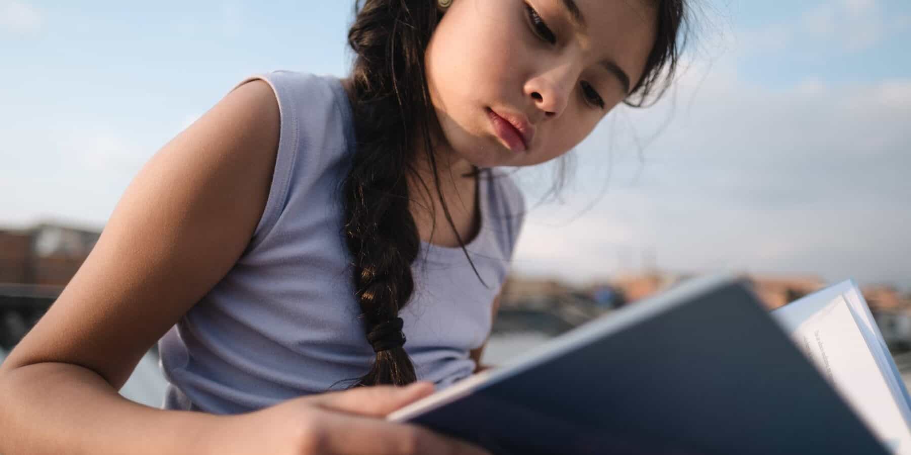 Young Girl reading a book