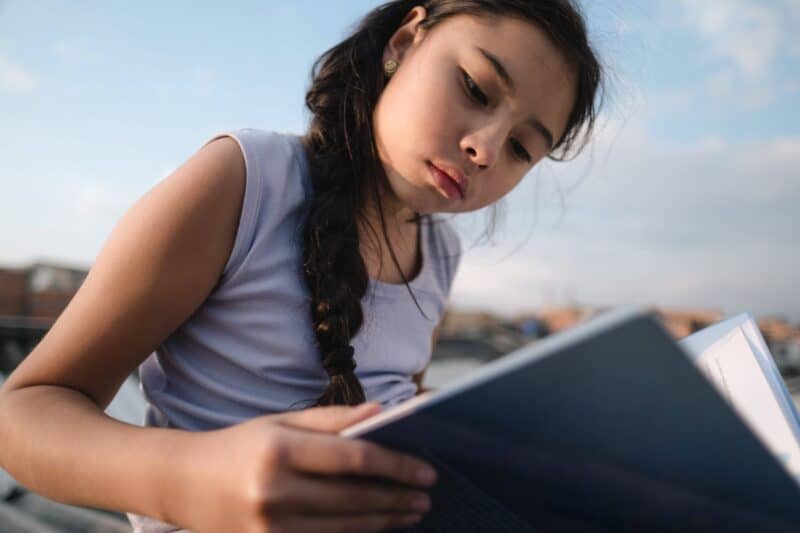 Young Girl reading a book