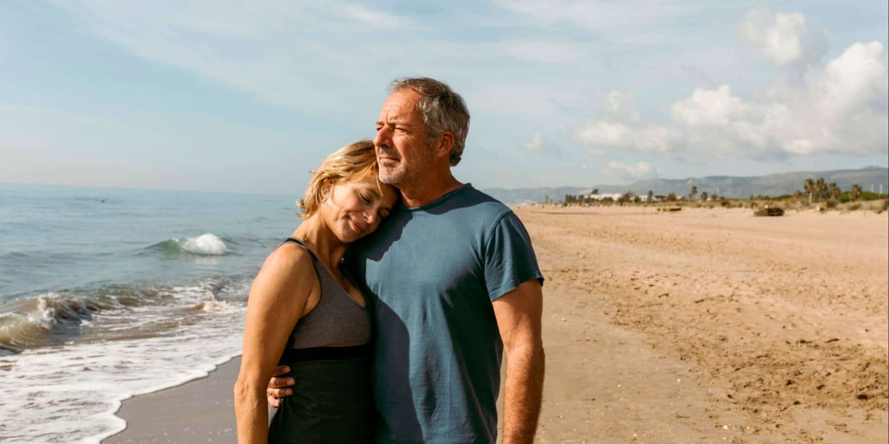mid-agers-hugging-beach_1800x1200 Image of a mid-aged couple hugging on the beach