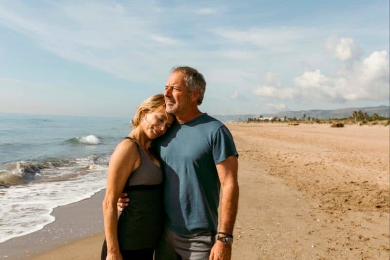 mid-agers-hugging-beach_1800x1200 Image of a mid-aged couple hugging on the beach