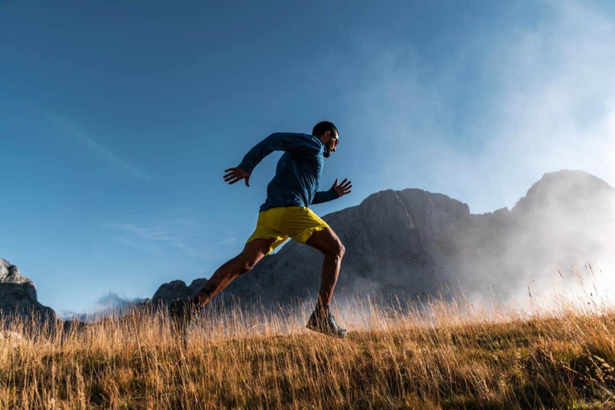 Image of a man jogging on a foggy hill
