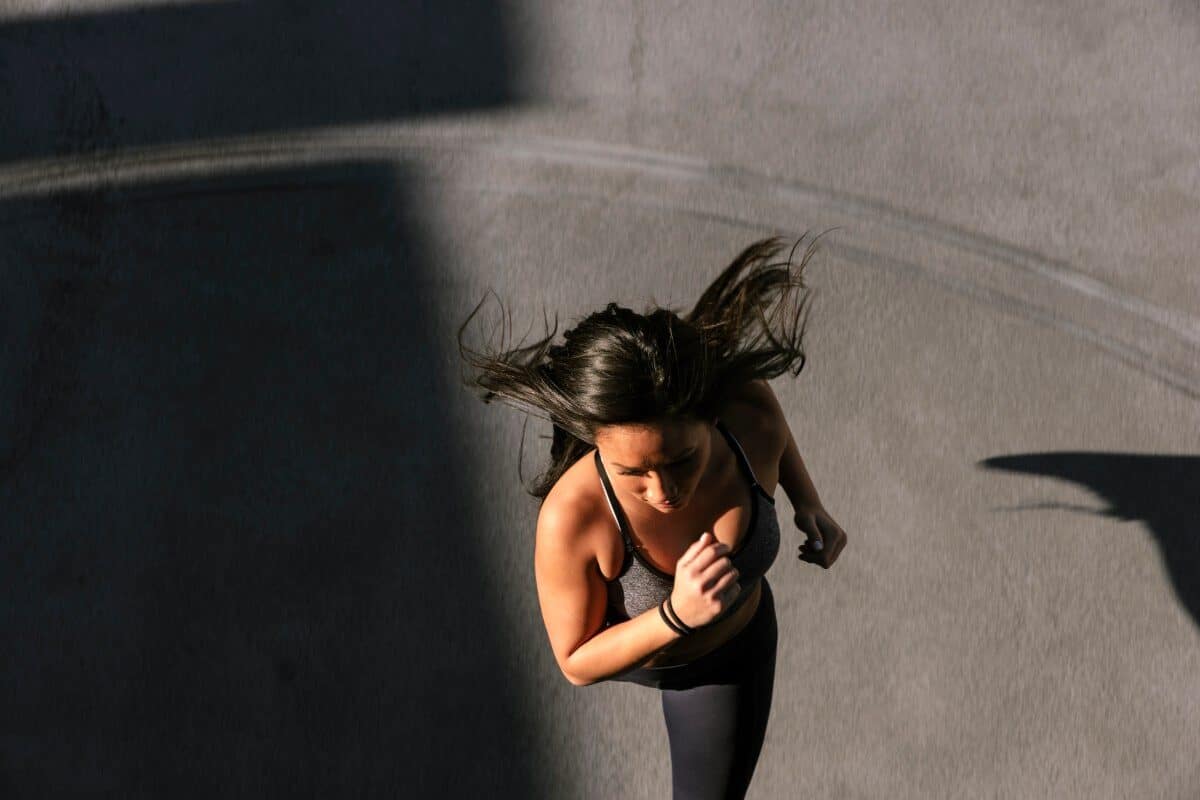 image of a woman running from above