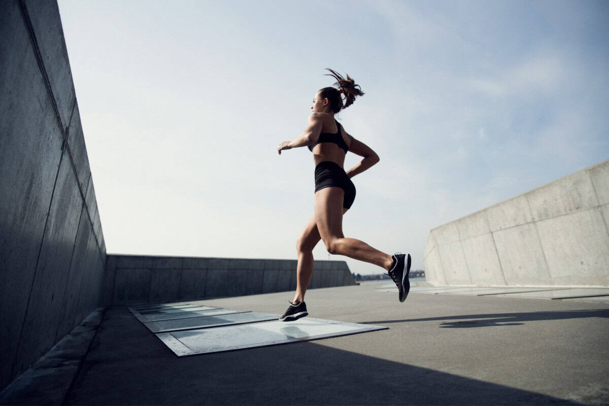 Image of a woman running on a sunny day