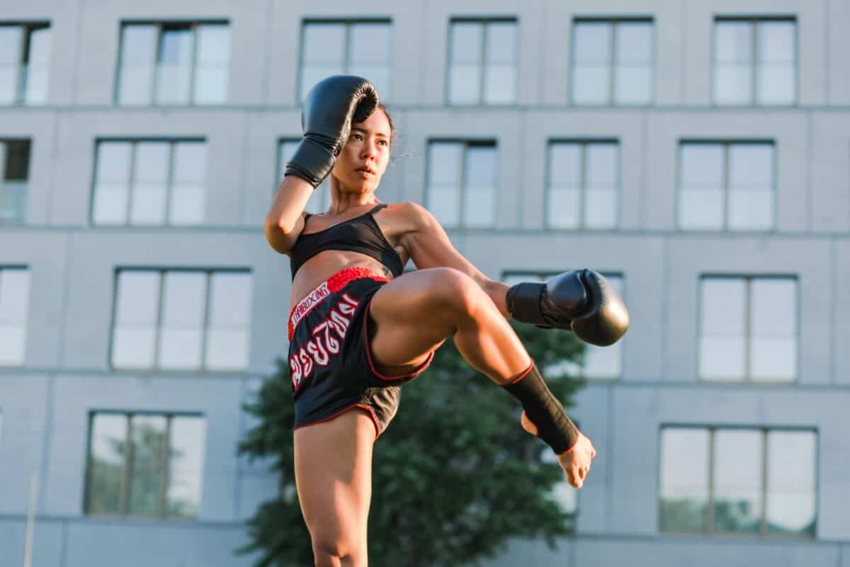 Woman kickboxing black shorts image