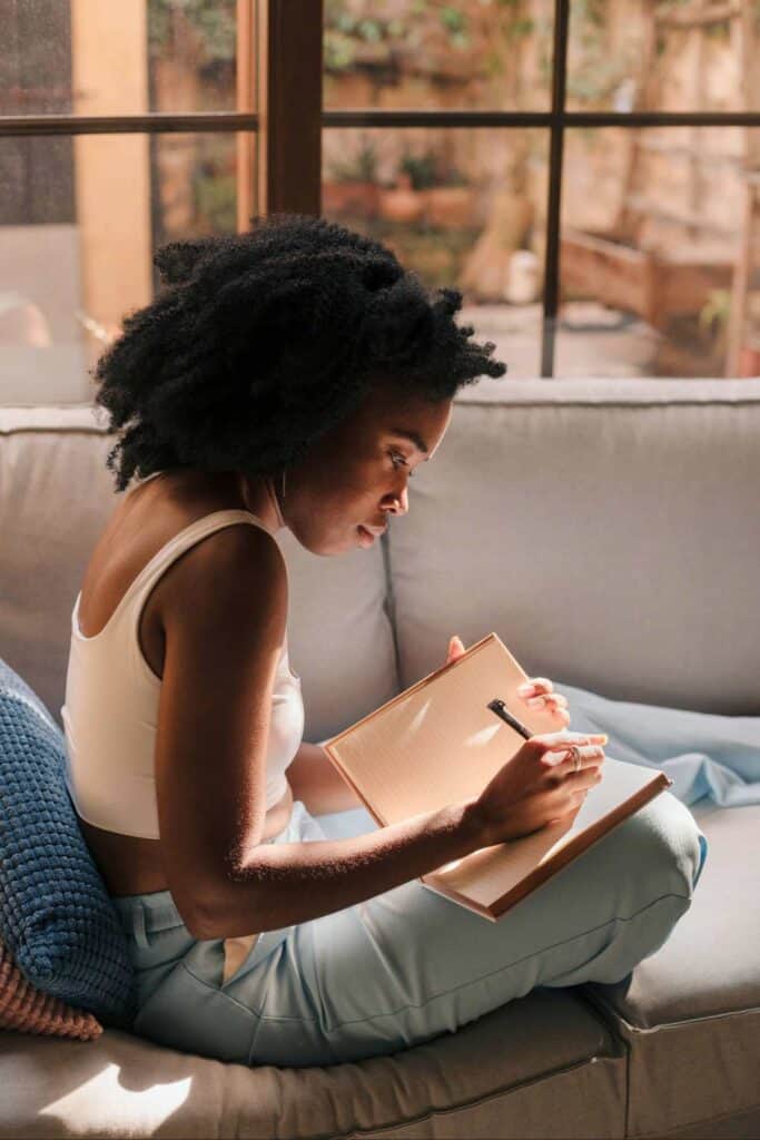 Image of a girl writing in a journal