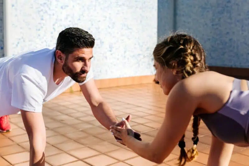 image of a man and woman working out.