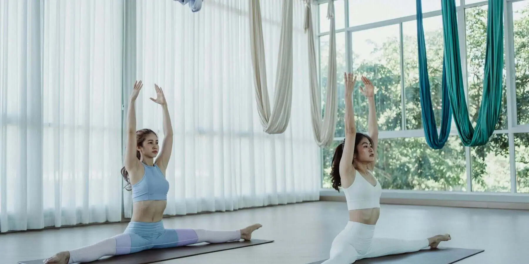 Image of two woman doing yoga