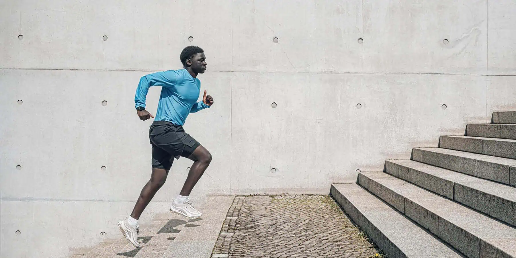 image of a man running on stairs