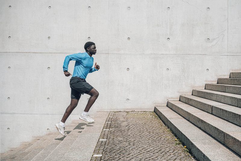 image of a man running on stairs