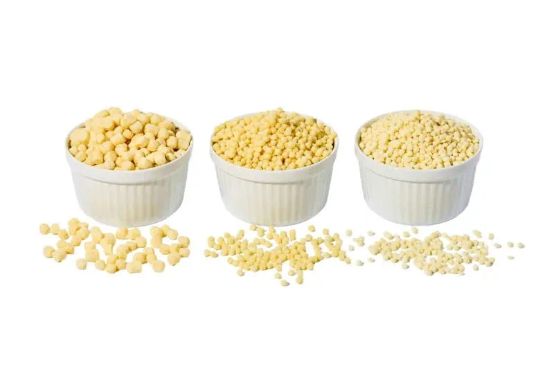 Image of three bowls of different formats of balchem's white, milk-protein crisps.
