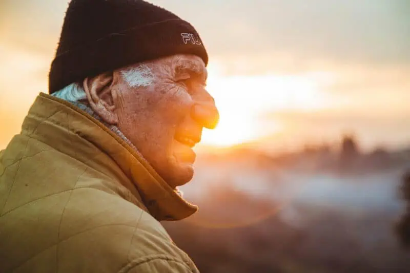 Image of a man looking into the sunset